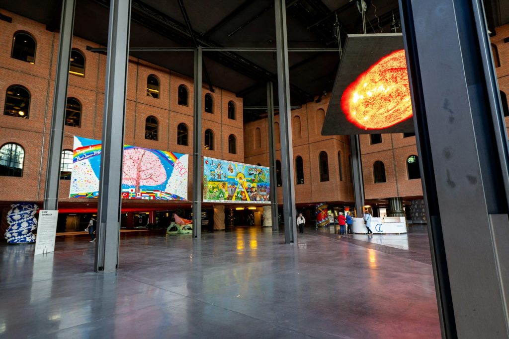 Modern art exhibition with colorful paintings on walls