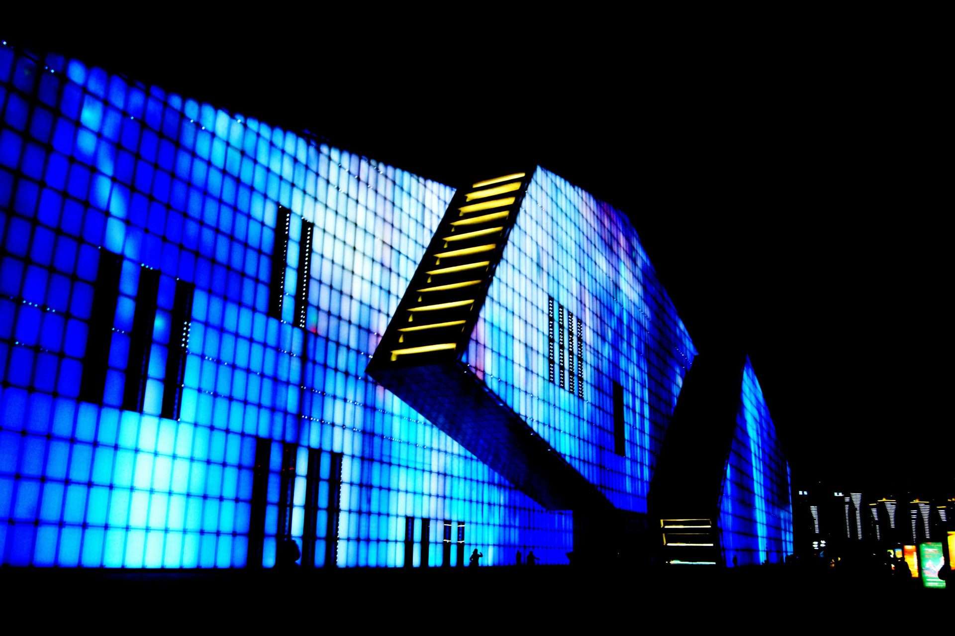 blue and black building during night time